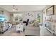 Comfortable living room featuring coastal decor and a view of the front door at 6235 Bixel Ln, Englewood, FL 34224