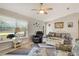 Comfortable living room with plenty of natural light and coastal decor at 6235 Bixel Ln, Englewood, FL 34224