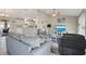 Open-concept living room with access to the kitchen and tile flooring at 6235 Bixel Ln, Englewood, FL 34224