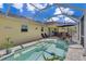 Relaxing screened-in pool area with outdoor seating, perfect for entertaining or enjoying a private swim at 6235 Bixel Ln, Englewood, FL 34224