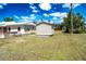 Spacious backyard with storage sheds and privacy at 6272 Sooner St, North Port, FL 34287
