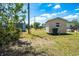 Storage sheds and greenery enhance this spacious backyard at 6272 Sooner St, North Port, FL 34287