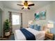 Bright bedroom features comfortable bed, beachy decor, and serene atmosphere at 6272 Sooner St, North Port, FL 34287