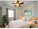 Inviting bedroom features comfortable bed, beachy decor, and serene atmosphere at 6272 Sooner St, North Port, FL 34287