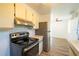 Efficient kitchen with modern appliances and ample cabinet space at 6272 Sooner St, North Port, FL 34287