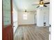 Bright living room featuring new floors, ceiling fan, and natural light at 6272 Sooner St, North Port, FL 34287