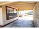 Covered patio with a view of the backyard, hot tub, and storage sheds at 6272 Sooner St, North Port, FL 34287