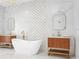 Spa-like bathroom featuring a soaking tub, gold accents, and dual wood vanities at 7200 Riverside Dr, Punta Gorda, FL 33982