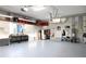 Bright and spacious finished garage space with white cabinets, storage and epoxy flooring at 7200 Riverside Dr, Punta Gorda, FL 33982