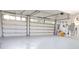 Spacious two car garage with epoxy flooring and access door with garage door openers at 7200 Riverside Dr, Punta Gorda, FL 33982