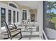 Covered patio with seating area provides a relaxing outdoor experience with a beautiful view at 7200 Riverside Dr, Punta Gorda, FL 33982