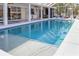 Large inviting pool with a spacious covered patio, outdoor kitchen, and beautiful landscaping, perfect for entertaining at 7200 Riverside Dr, Punta Gorda, FL 33982