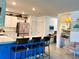 Bright kitchen featuring a blue center island with bar seating and stylish modern appliances at 7232 W Lenox Cir, Punta Gorda, FL 33950