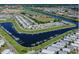 This aerial view depicts an active over-55 community with waterfront and recreational amenities at 805 S Green Cir, Venice, FL 34285