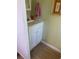 Bathroom vanity featuring a sink and storage at 805 S Green Cir, Venice, FL 34285