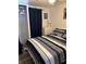 Bedroom with comfortable bed, closet, and dresser at 805 S Green Cir, Venice, FL 34285
