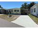 Charming single-story home with a covered carport and well-maintained landscaping at 805 S Green Cir, Venice, FL 34285