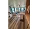 Bright sitting area with vinyl floors and views of the backyard at 805 S Green Cir, Venice, FL 34285