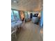 Sunny sun room with ample natural light and comfortable seating at 805 S Green Cir, Venice, FL 34285