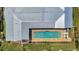 Aerial view of a modern home with a private pool and lush landscaping at 810 Napoli Ln, Punta Gorda, FL 33950