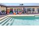Stunning backyard featuring a large pool, outdoor seating, and a dining area for ultimate relaxation and entertainment at 810 Napoli Ln, Punta Gorda, FL 33950