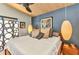 Bedroom with a large bed and modern hanging lights at 810 Napoli Ln, Punta Gorda, FL 33950