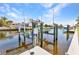 Private boat lift on the waterway, offering convenient access for boating and waterfront living at 810 Napoli Ln, Punta Gorda, FL 33950