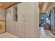 Spacious walk-in closet with ample storage and a glimpse into the stylishly decorated room at 810 Napoli Ln, Punta Gorda, FL 33950