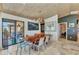 Dining area with open-concept design, custom chandelier, and views to the outdoor space at 810 Napoli Ln, Punta Gorda, FL 33950