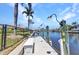 Picturesque waterfront dock with boat access, ideal for boating and enjoying waterfront activities in a serene setting at 810 Napoli Ln, Punta Gorda, FL 33950