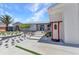 Beautiful modern home featuring a landscaped front yard and unique architectural details at 810 Napoli Ln, Punta Gorda, FL 33950