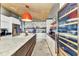 Another view of the bright kitchen featuring a large island and modern wine fridge at 810 Napoli Ln, Punta Gorda, FL 33950