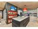 Open kitchen with a large island, face-themed wallpaper, and stainless steel appliances at 810 Napoli Ln, Punta Gorda, FL 33950