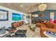 Stylish living room with a large TV, modern furniture, and unique decor at 810 Napoli Ln, Punta Gorda, FL 33950