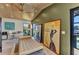 Bright living room with a modern couch, expansive windows, and water views at 810 Napoli Ln, Punta Gorda, FL 33950