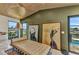 Inviting living room with a modern couch, expansive windows, and water views at 810 Napoli Ln, Punta Gorda, FL 33950
