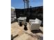 Stylish outdoor seating area featuring modern chairs, side tables, and decorative greenery at 810 Napoli Ln, Punta Gorda, FL 33950