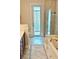 Bathroom featuring tile floors, a soaking tub, separate shower, and double vanity at 8233 Burwell Cir, Port Charlotte, FL 33981