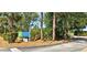South Gulf Cove Park sign with crosswalk, lush landscaping, and mature trees at 8233 Burwell Cir, Port Charlotte, FL 33981