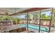 Inviting screened patio overlooking a sparkling pool and lush landscaping at 8233 Burwell Cir, Port Charlotte, FL 33981