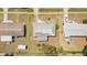 Aerial view displays the roof, driveway, yard, and neighborhood at 8238 San Jacinto Ave, North Port, FL 34287
