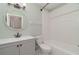 Bathroom featuring a shower-tub combo, a modern vanity and mirror, and neutral paint at 8238 San Jacinto Ave, North Port, FL 34287