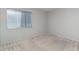 Bedroom featuring neutral paint and carpet, and a large window at 8238 San Jacinto Ave, North Port, FL 34287