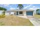 Charming one-story home with a well-maintained front yard and attached garage at 8238 San Jacinto Ave, North Port, FL 34287