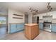 Well-equipped kitchen with stainless steel appliances and a kitchen island at 8238 San Jacinto Ave, North Port, FL 34287