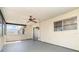 Enclosed lanai with concrete flooring and a ceiling fan, providing additional living space at 8238 San Jacinto Ave, North Port, FL 34287