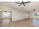 Bright and airy living room with large windows and modern ceiling fans at 8238 San Jacinto Ave, North Port, FL 34287