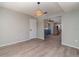 Living room with neutral paint, hardwood floors, and views into the adjacent eat-in kitchen at 8238 San Jacinto Ave, North Port, FL 34287