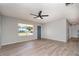 Inviting living room features new floors and a bright, sunlit window at 8238 San Jacinto Ave, North Port, FL 34287