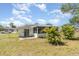 The rear of the property shows a screened in porch and mature landscaping at 8238 San Jacinto Ave, North Port, FL 34287